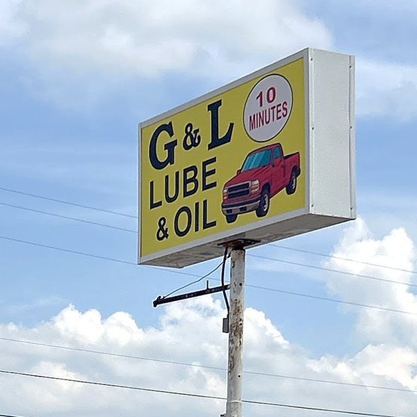 The yellow roadside sign against the sky